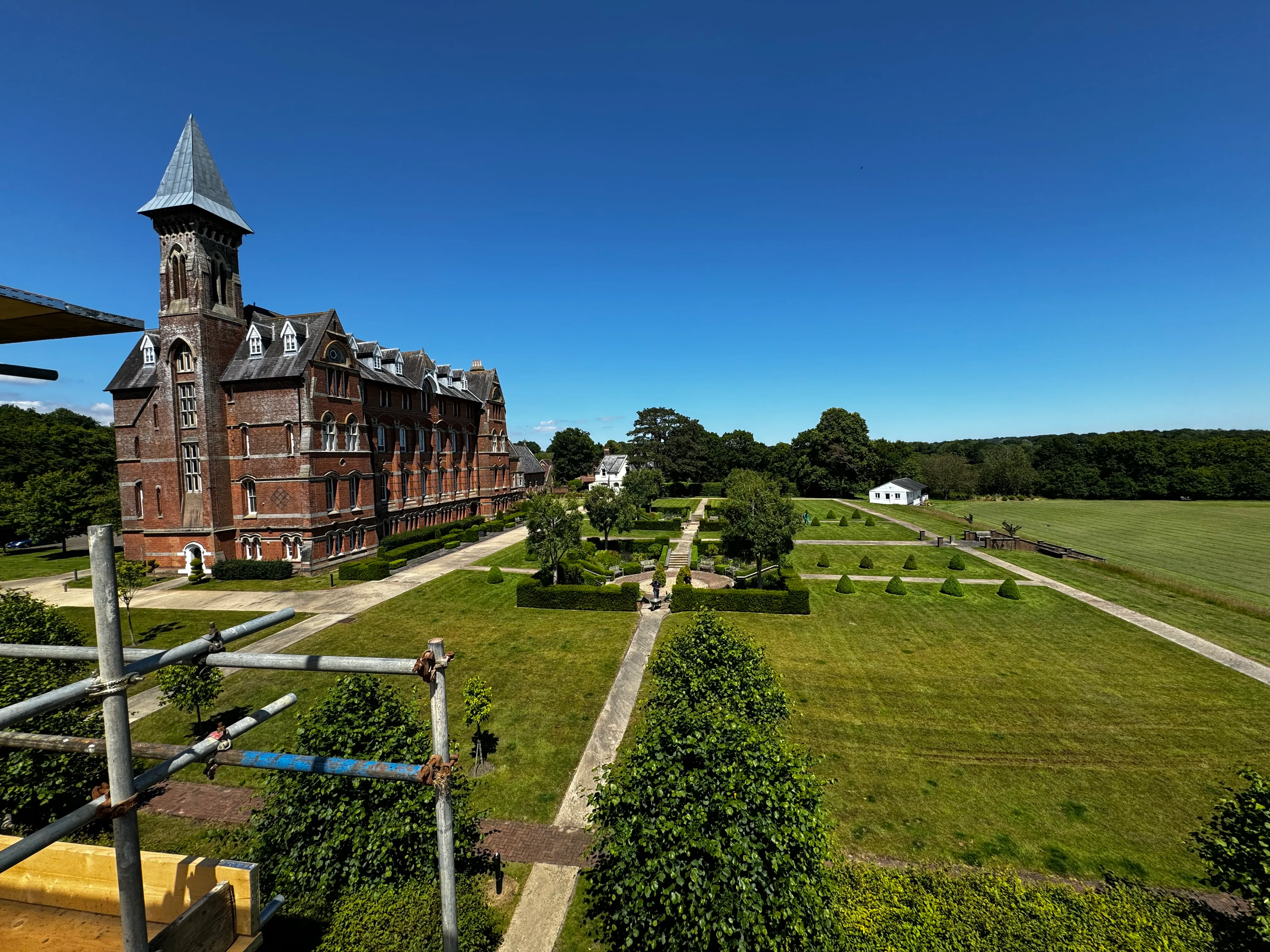 Aerial view of a large Victorian building and its formal gardens during insurance reinstatement works