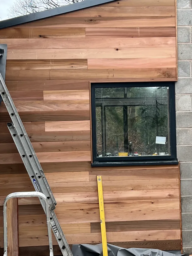 Cedar cladding detail around a window