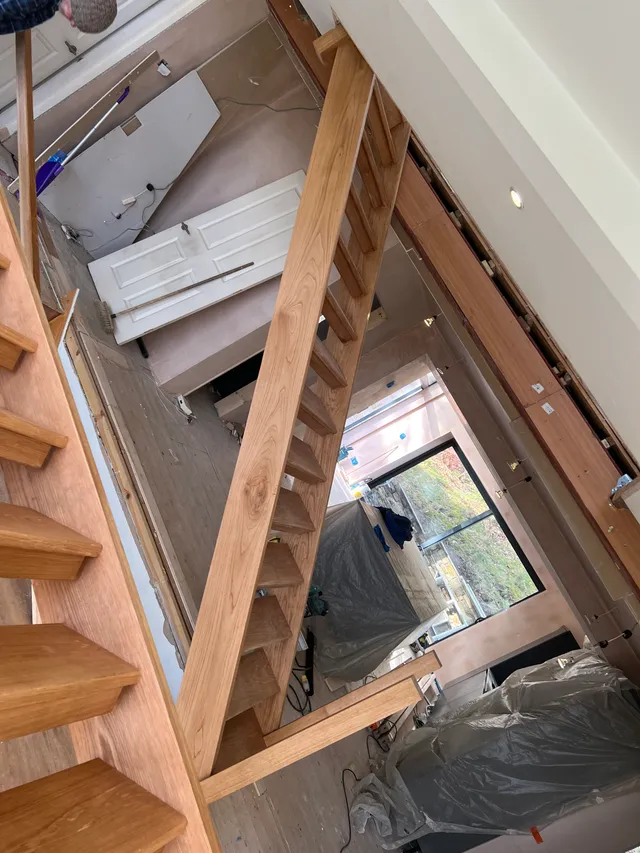 Timber roof framing above the staircase void