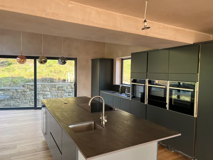 Kitchen with dark cabinetry